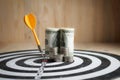 Yellow dart arrow hit the center target of dartboard and money c Royalty Free Stock Photo