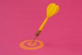 Yellow dart arrow hitting in the yellow target center Royalty Free Stock Photo