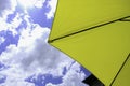 Yellow Deck patio umbrella outside under sunny skies