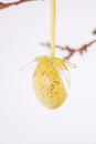 Yellow decorative hanging easter egg with ribbon bow Royalty Free Stock Photo