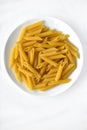Yellow delicious pasta close-up on a white plate Royalty Free Stock Photo