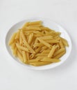 Yellow delicious pasta close-up on a white plate Royalty Free Stock Photo