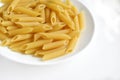 Yellow delicious pasta close-up on a white plate Royalty Free Stock Photo