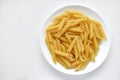 Yellow delicious pasta close-up on a white plate Royalty Free Stock Photo