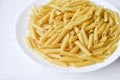 Yellow delicious pasta close-up on a white plate Royalty Free Stock Photo