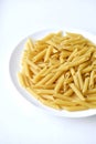 Yellow delicious pasta close-up on a white plate Royalty Free Stock Photo