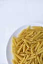 Yellow delicious pasta close-up on a white plate Royalty Free Stock Photo