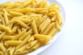 Yellow delicious pasta close-up on a white plate Royalty Free Stock Photo