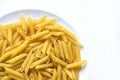 Yellow delicious pasta close-up on a white plate Royalty Free Stock Photo