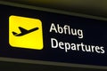 Yellow departures sign in German and English Royalty Free Stock Photo