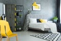 Yellow designer chair in bedroom Royalty Free Stock Photo