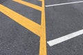 Yellow detail lines of parking on asphalt