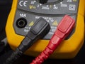 Yellow digital multimeter electrical measuring equipment Royalty Free Stock Photo