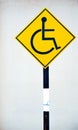 Yellow disable handicap parking sign board Royalty Free Stock Photo