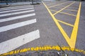 Yellow dividing lines on dark asphalt, abstract road marking background photo texture Royalty Free Stock Photo