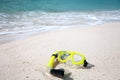 Yellow diving mask on the beach Royalty Free Stock Photo