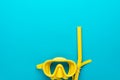 Yellow diving mask and snorkel over blue background with copy space Royalty Free Stock Photo