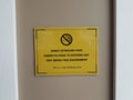 Yellow do not smoke sign on wall Royalty Free Stock Photo