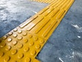 Yellow Dome and Block of Tactile Paving Which Act as A Guidance for Visually Impaired or Blind Citizen To Avoid Hazard Royalty Free Stock Photo