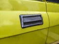 Yellow door detail of old vintage classic car Royalty Free Stock Photo