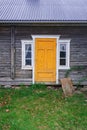the yellow door of the old log-house Royalty Free Stock Photo
