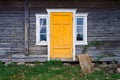 the yellow door of the old log-house Royalty Free Stock Photo