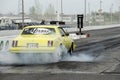 Yellow drag car smoke show