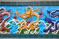 Yellow dragon on blue background, ceramics. Nine-Dragon Wall at Garden of Friendship, St. Petersburg, Russia. This is copy of the Royalty Free Stock Photo