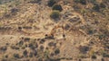 Yellow dredger digger mine excavate rocky ground in countryside mountain area in Troodos