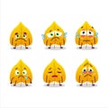 Yellow dried leaves cartoon character with sad expression