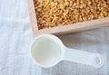 Yellow Dried Soybeans with Empty Measuring Spoon