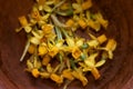 Yellow dried sprig flowers in the brow bowl