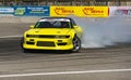 Yellow drift car brand Nissan overcome turn track