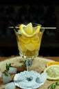 yellow drink in glass on high stem