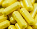 Yellow Drug Capsules closeup Royalty Free Stock Photo