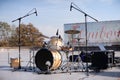 Yellow drums set on the empty stage at the city park