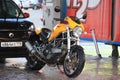 Yellow Ducati Monster motorcycle on a car wash Royalty Free Stock Photo