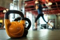 Dumbbells with Fitness girl exercising in Gym background Royalty Free Stock Photo