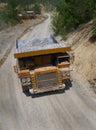 Yellow dump truck on coper surface mining Royalty Free Stock Photo