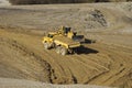 Yellow dump truck working in gravel pit Royalty Free Stock Photo