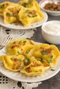 Yellow dumplings with turmeric, fried onions and parsley Royalty Free Stock Photo