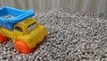 Yellow Dumptruck Children Toy On Wooden Small Blocks