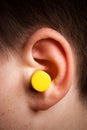 Yellow earplug Royalty Free Stock Photo