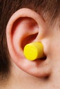 Yellow earplug Royalty Free Stock Photo