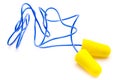 Yellow earplugs with blue band. Royalty Free Stock Photo