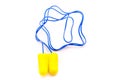 Yellow earplugs with blue band. Royalty Free Stock Photo