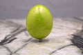 Yellow egg timer on grey wooden background . Royalty Free Stock Photo