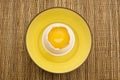Yellow Egg Yolk in a Cracked Eggshell Royalty Free Stock Photo