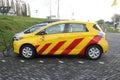 Yellow electric car loading, car used by the state provincie of Zuid Holland in the Netherlands