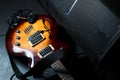 Yellow electric guitar and black amplifier on a dark background, close-up Royalty Free Stock Photo